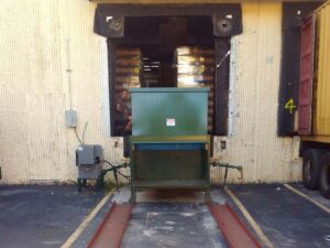 Stationary compactors and rolloff compaction containers