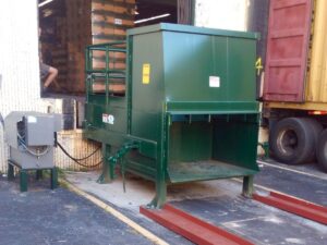 Stationary compactors and rolloff compaction containers