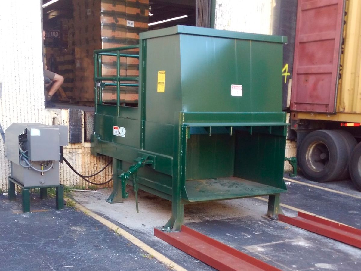 Stationary compactors and rolloff compaction containers