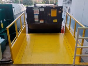 Stationary compactors and rolloff compaction containers