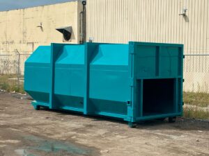 Stationary compactors and rolloff compaction containers