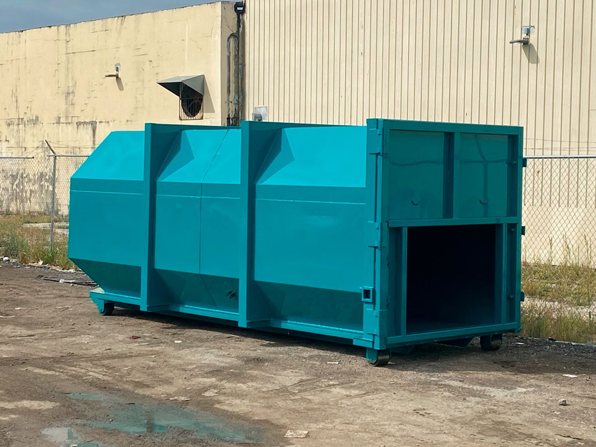 Stationary compactors and rolloff compaction containers